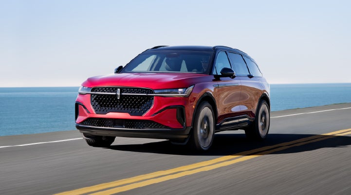 A 2025 Lincoln Nautilus® SUV is being driven on a seaside roadway. | Beach Lincoln in Myrtle Beach SC