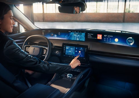 The driver of a 2025 Lincoln Nautilus® SUV interacts with the center touchscreen. | Beach Lincoln in Myrtle Beach SC