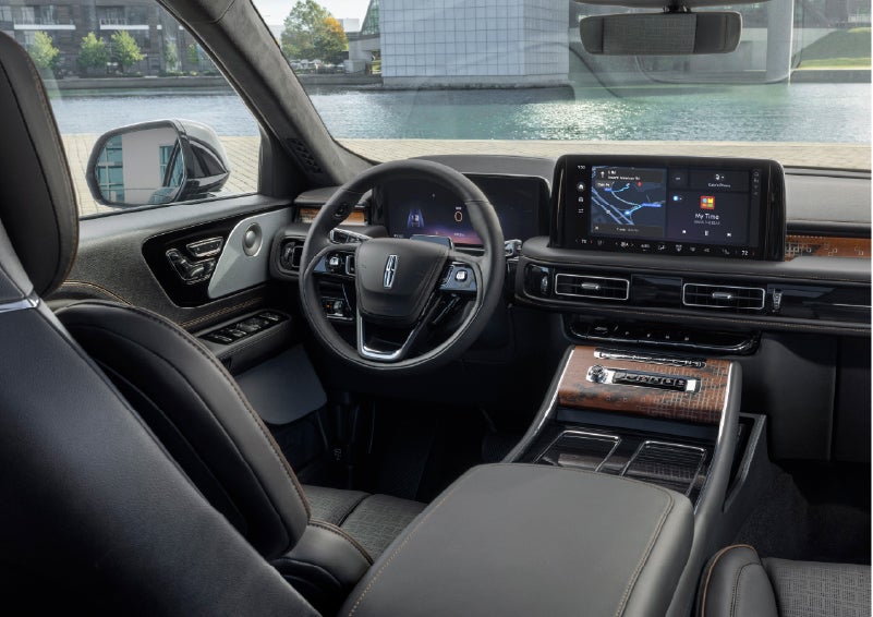 The interior of the 2026 Lincoln Aviator® SUV is shown parked with a view of a harbor through the windshield. | Beach Lincoln in Myrtle Beach SC