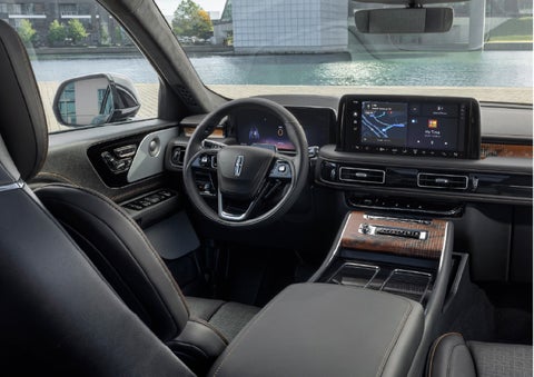 The interior of the 2026 Lincoln Aviator® SUV is shown parked with a view of a harbor through the windshield. | Beach Lincoln in Myrtle Beach SC
