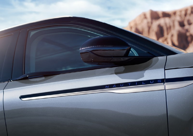 Blue lettering on the side of the vehicle that reads Nautilus indicates the available Hybrid Powertrain. | Beach Lincoln in Myrtle Beach SC