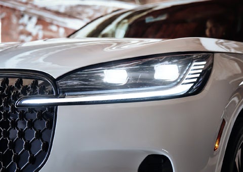 A close-up of a headlamp on the 2027 Lincoln Aviator® SUV is shown. | Beach Lincoln in Myrtle Beach SC