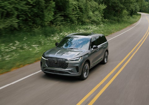 A 2027 Lincoln Aviator® SUV is being driven down a road. | Beach Lincoln in Myrtle Beach SC